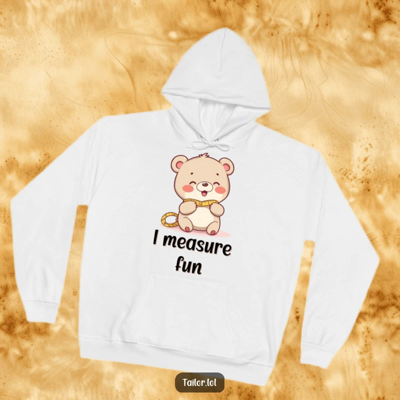 Funny hoodie with a playful bear giggling while measuring fabric, ideal as a warm and humorous gift.